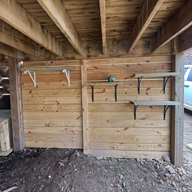 Enclosed storage with shelves built under a deck